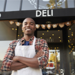 man in front of his deli